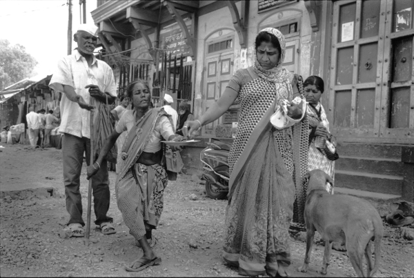 Indian street scene,Giving and Receiving,India,gelatin silver print